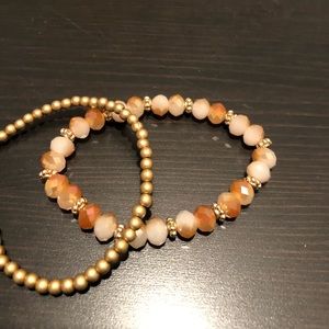 Peach and gold bracelet stack